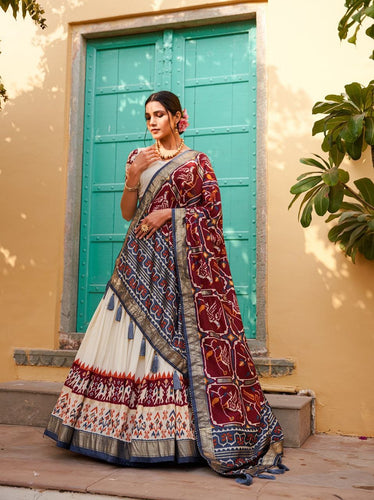 Tussar silk and patola print Lehenga in white and maroon
