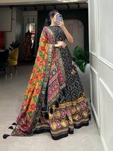 Royal ensemble of bandhej and patola print Lehenga in black