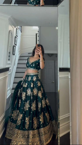 Emerald green and gold motifs lehenga