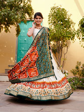 Tussar silk and patola print Lehenga in white and orange