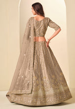 Champagne and gold embroidered art silk Lehenga
