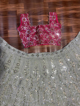 Exquisite diamond silk sage green Lehenga with contrasting colours