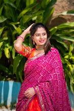Orange jacquard silk and pink bandhani Lehenga