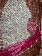 Exquisite diamond silk sage green Lehenga with contrasting colours