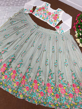 Sage green with a pop of floral colour lehenga