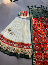 Tussar silk and patola print Lehenga in white and orange