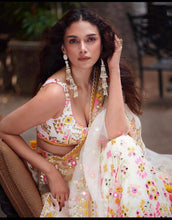 White Lehenga with multi coloured thread work