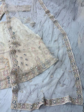Ivory lehenga with peacock and sequin embroidery