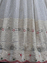 White lehenga with thread work and green bandhani dupatta