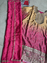 Pink and yellow bandhani print flared pants suit