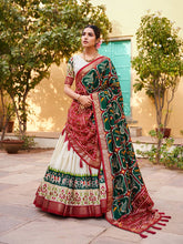 Tussar silk and patola print Lehenga in white and green