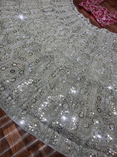 Exquisite diamond silk sage green Lehenga with contrasting colours