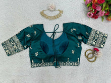 Emerald green and gold motifs lehenga