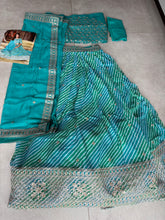 Blue and green Leheriya print organza lehenga