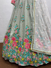 Sage green with a pop of floral colour lehenga