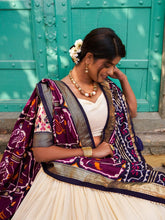 Tussar silk and patola print Lehenga in white and purple