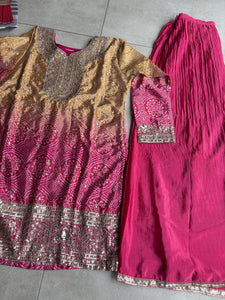 Pink and yellow bandhani print flared pants suit