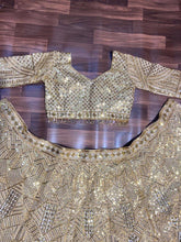 Golden hour - gold embellished net Lehenga
