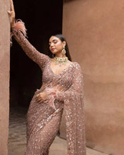 Rose champagne net saree with tassels on blouse