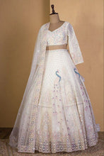 Ivory lehenga with peacock and sequin embroidery