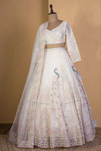 Ivory lehenga with peacock and sequin embroidery