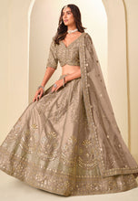 Champagne and gold embroidered art silk Lehenga