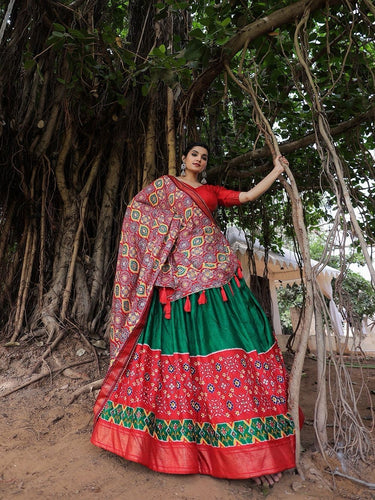 Traditional dola silk twirling lehengas in green
