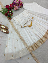 White georgette gown with gold sequins