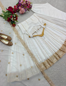 White georgette gown with gold sequins