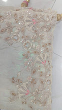 Woven art silk sequinned saree in white