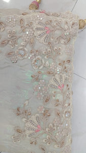 Woven art silk sequinned saree in white