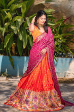 Orange jacquard silk and pink bandhani Lehenga