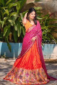 Orange jacquard silk and pink bandhani Lehenga