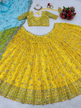 Yellow sequins Lehenga paired with blue net dupatta