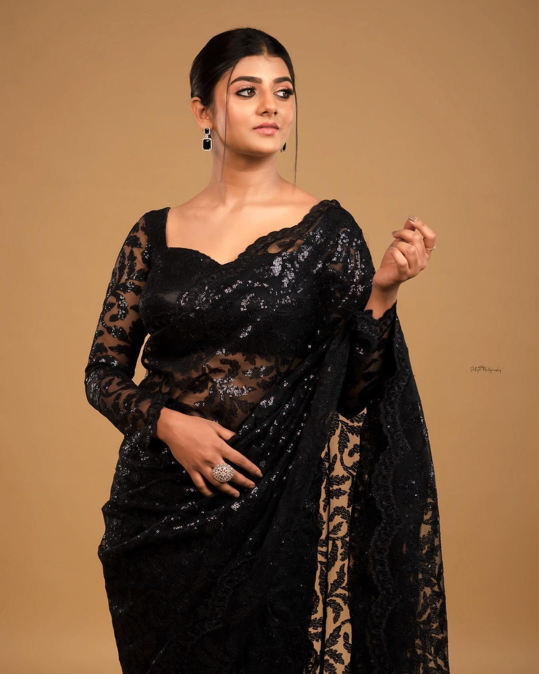 Black sequinned saree with long sleeves blouse