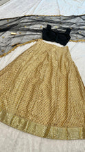 Black and gold silk Lehenga
