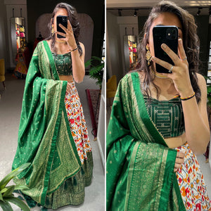 Green Dola silk and patola print Lehengas