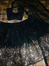 The stunner in Georgette - Black and gold sequins Lehenga