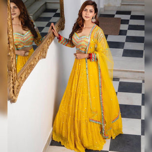 Yellow tiered Lehenga with embroidered blouse