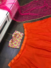 Orange and pink sangeet night Lehenga