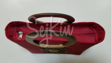 Red wooden handle tote