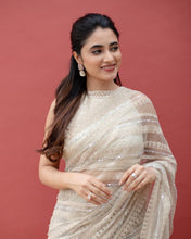Off white net sequins embroidered saree