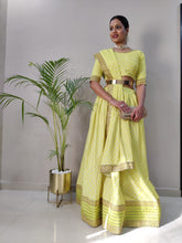 Pastel lemon yellow silk Lehenga with metal belt