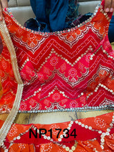 Niks collection - a gorgeous blend of red bandhani lehenga