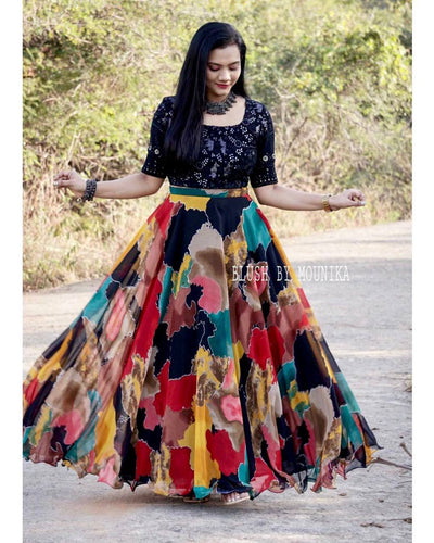 Fancy black and colourful, lots of flair Lehenga