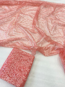 Celebrity inspired peachy pink swirly sequinned saree