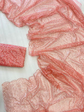 Celebrity inspired peachy pink swirly sequinned saree