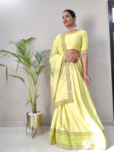Pastel lemon yellow silk Lehenga with metal belt