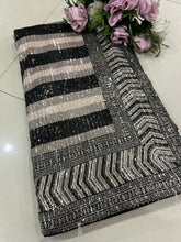 Beauty in a black sequins saree