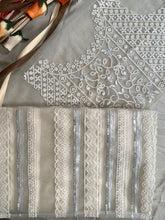 Off white net sequins embroidered saree